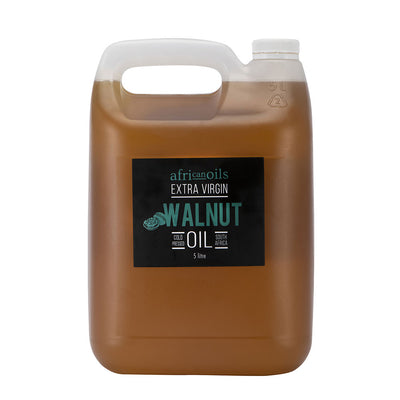 A plastic container of African Oils' Extra Virgin Walnut Oil with a label showing the brand and product name.